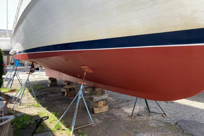 Slide: The Image of 1988 Grand Banks 42 Classic yacht on stands, showcasing its hull design. - 38