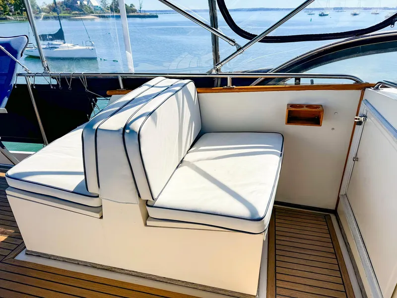Slide: The Image of 1988 Grand Banks 42 Classic yacht seating area with ocean view. - 7