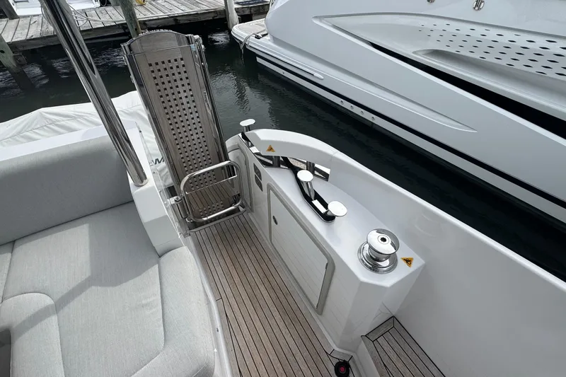 Slide: The Image of Azimut 50 Flybridge 2021 yacht deck with seating and mooring equipment. - 14