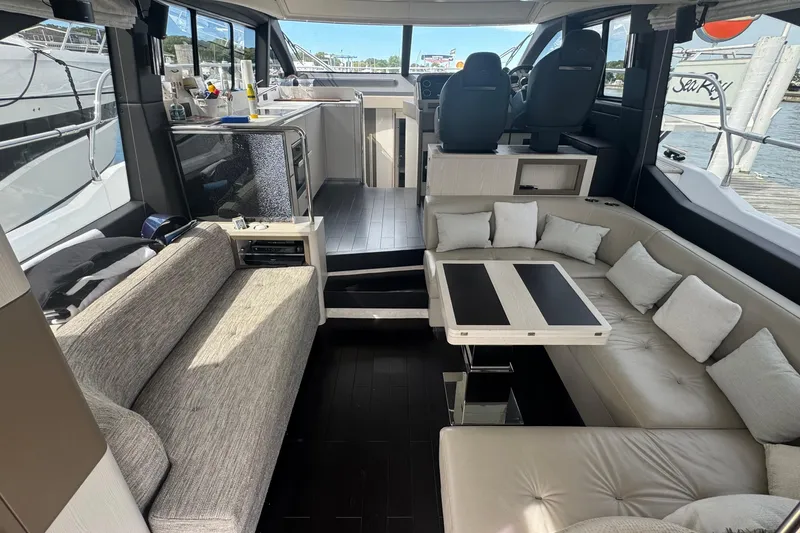 Slide: The Image of Luxurious interior of 2021 Azimut 50 Flybridge yacht with plush seating and modern design. - 16