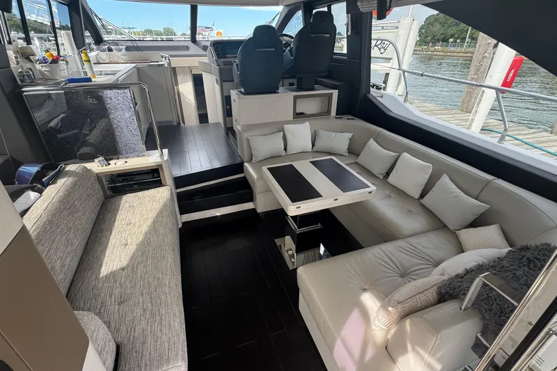 Slide: The Image of Luxurious interior of 2021 Azimut 50 Flybridge yacht with modern seating and helm. - 17