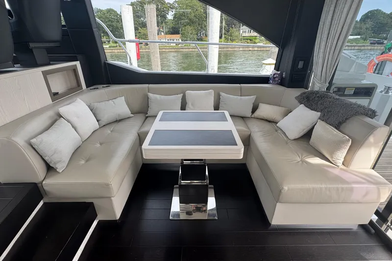 Slide: The Image of Luxurious interior of 2021 Azimut 50 Flybridge yacht with elegant seating and table. - 19
