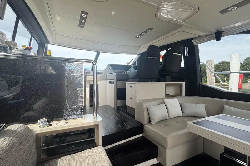 Slide: The Image of Luxurious interior of 2021 Azimut 50 Flybridge yacht with modern seating and helm. - 20