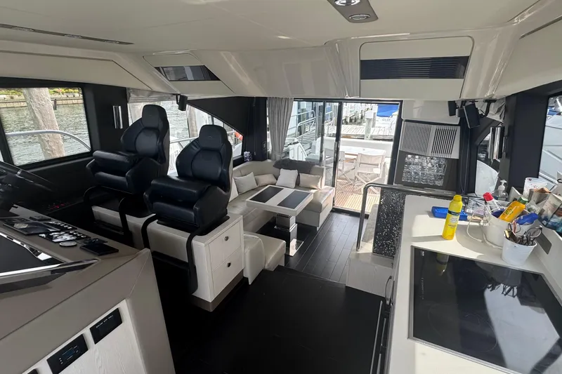 Slide: The Image of Interior of 2021 Azimut 50 Flybridge yacht with modern seating and sleek design. - 23