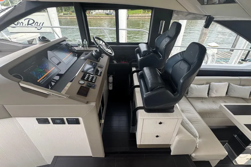 Slide: The Image of Interior of 2021 Azimut 50 Flybridge yacht with modern helm and seating. - 24
