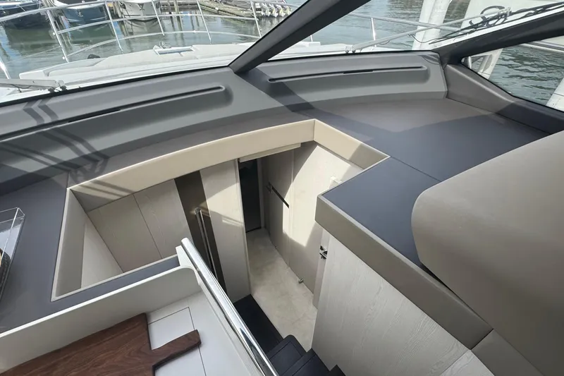 Slide: The Image of Interior view of 2021 Azimut 50 Flybridge yacht, showcasing modern design and sleek finishes. - 28