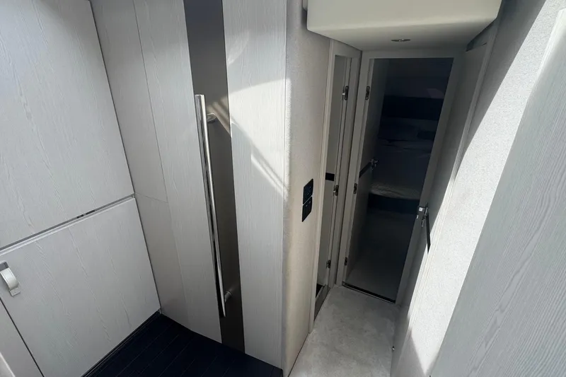 Slide: The Image of Interior hallway of 2021 Azimut 50 Flybridge yacht, featuring modern design and sleek finishes. - 31