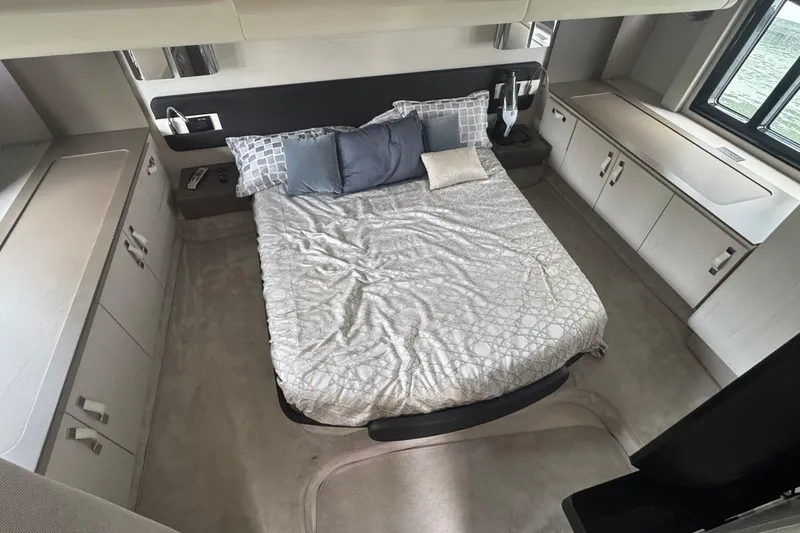 Slide: The Image of Luxurious bedroom interior of 2021 Azimut 50 Flybridge yacht with modern design and cozy bedding. - 35
