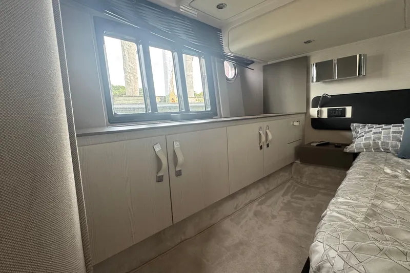 Slide: The Image of Interior of 2021 Azimut 50 Flybridge yacht cabin with modern design and window view. - 38