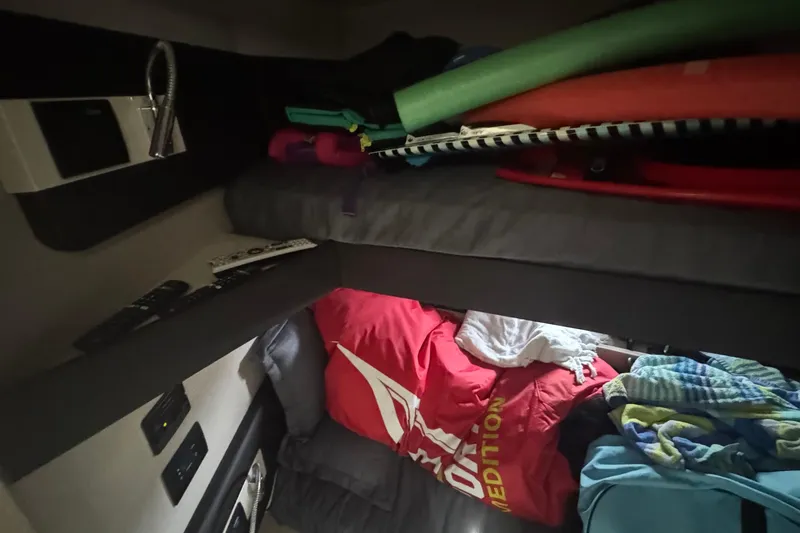 Slide: The Image of Interior cabin of 2021 Azimut 50 Flybridge yacht with storage and bedding. - 42