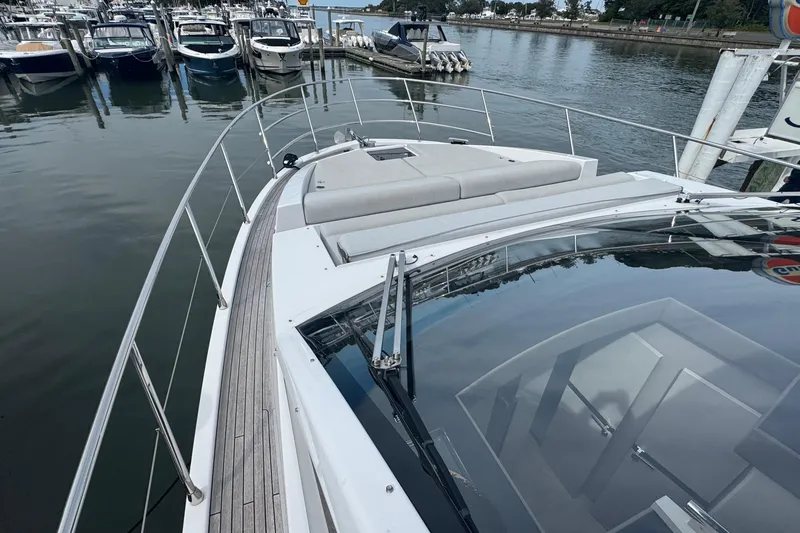 Slide: The Image of Azimut 50 Flybridge 2021 yacht docked at marina, showcasing sleek design and spacious deck. - 44