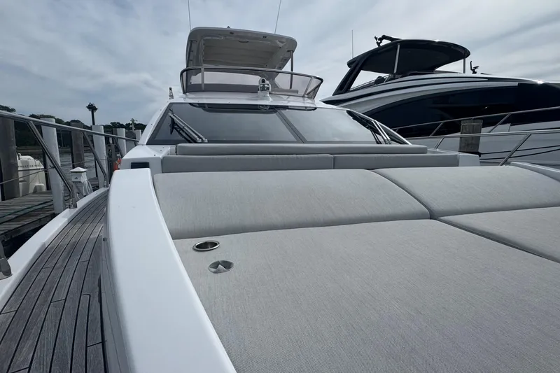 Slide: The Image of Azimut 50 Flybridge 2021 yacht with sleek design and spacious deck at marina. - 49