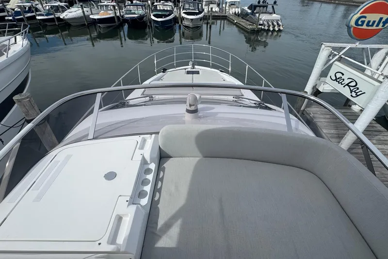 Slide: The Image of 2021 Azimut 50 Flybridge yacht docked at marina, view from bow. - 60