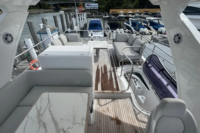 Slide: The Image of Luxurious 2021 Azimut 50 Flybridge yacht interior with elegant seating and marble table. - 62
