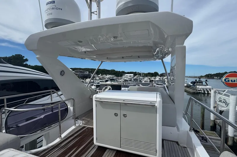 Slide: The Image of Flybridge of 2021 Azimut 50 yacht docked at marina, featuring sleek design and modern amenities. - 66