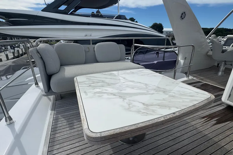 Slide: The Image of Luxurious Azimut 50 Flybridge 2021 yacht with elegant outdoor seating and marble table. - 67