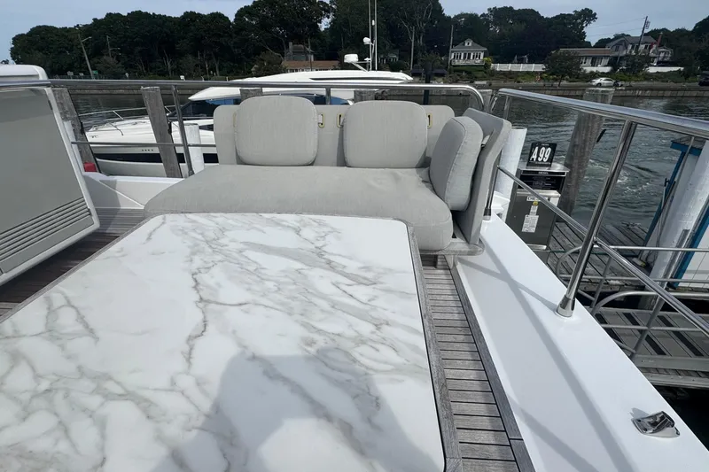 Slide: The Image of Luxurious seating area on 2021 Azimut 50 Flybridge yacht with marble table. - 68