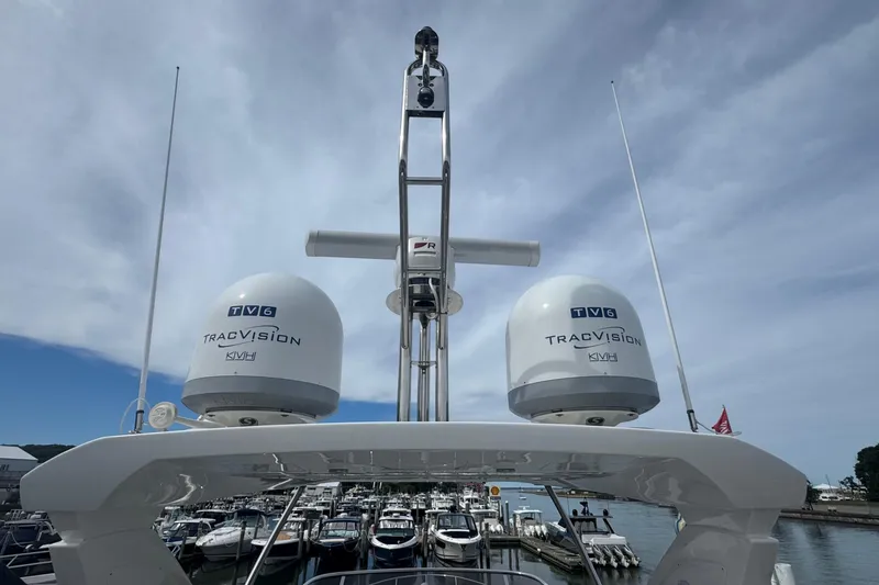 Slide: The Image of 2021 Azimut 50 Flybridge yacht with TracVision satellite domes at marina. - 70
