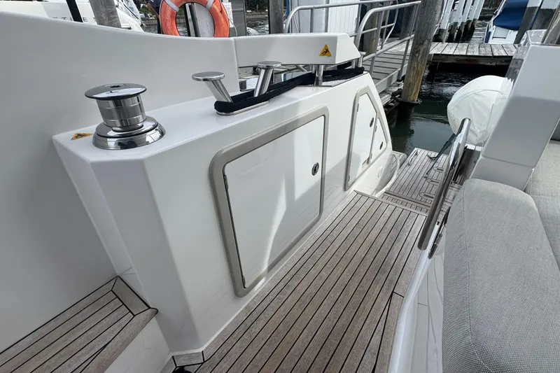 Slide: The Image of 2021 Azimut 50 Flybridge yacht deck with sleek design and modern fittings. - 8