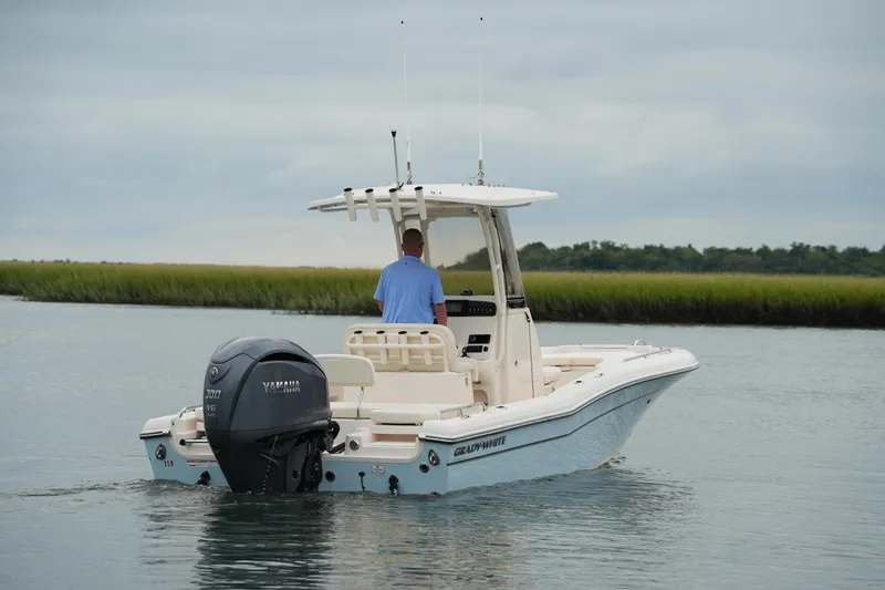 Slide: The Image of 2023 Grady-White 251 Coastal Explorer boat on calm water, rear view. - 2