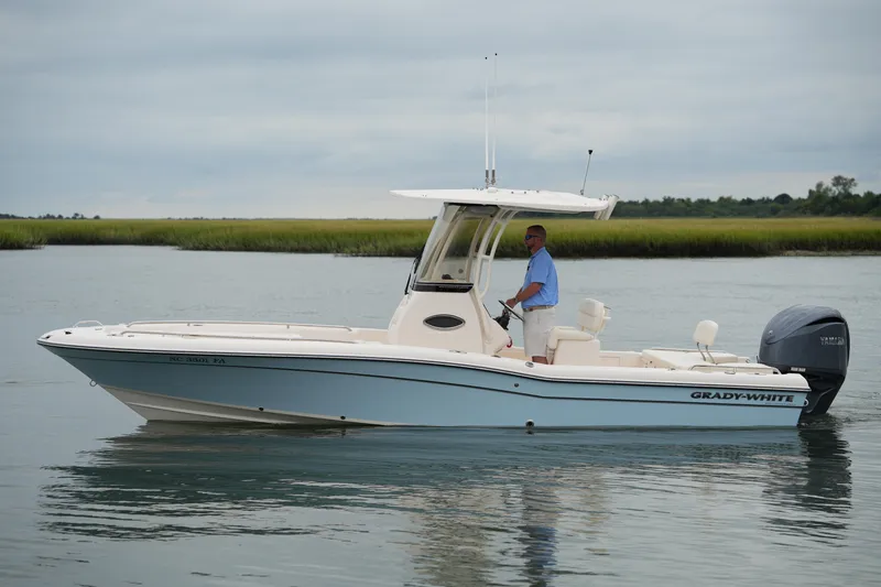 Slide: The Image of 2023 Grady-White 251 Coastal Explorer boat on calm water, side view. - 20