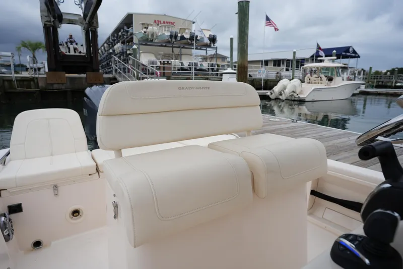 Slide: The Image of 2023 Grady-White 251 Coastal Explorer boat interior at marina dock. - 26