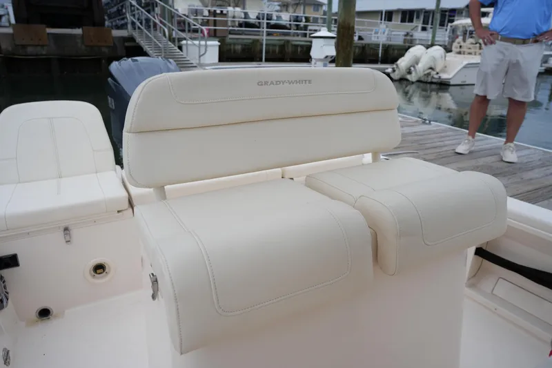 Slide: The Image of 2023 Grady-White 251 Coastal Explorer boat seating at marina dock. - 28