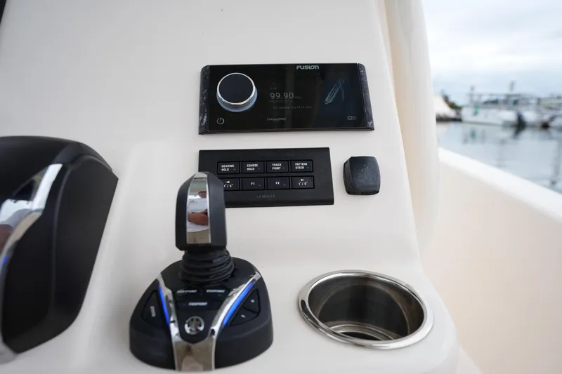 Slide: The Image of Control panel of 2023 Grady-White 251 Coastal Explorer boat with joystick and display. - 31