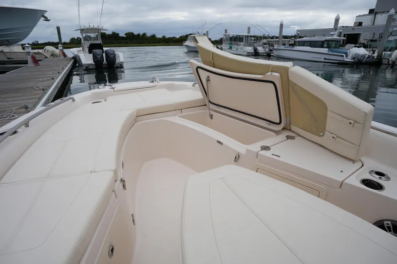 Slide: The Image of 2023 Grady-White 251 Coastal Explorer boat interior at marina dock. - 42