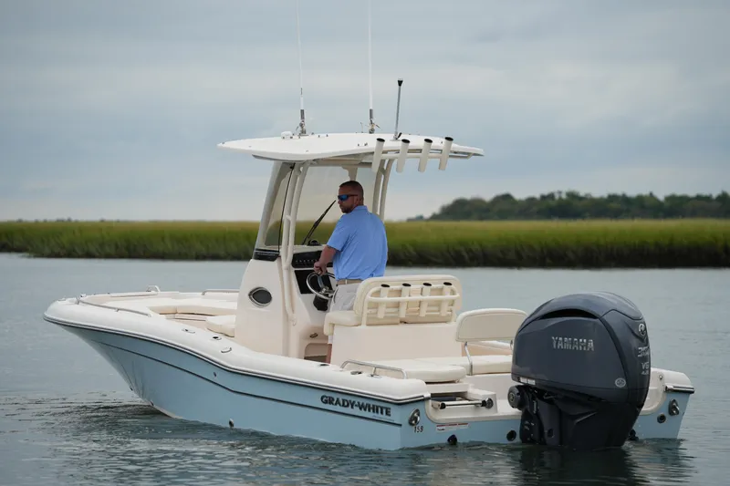 Slide: The Image of 2023 Grady-White 251 Coastal Explorer boat on water with Yamaha engine. - 5