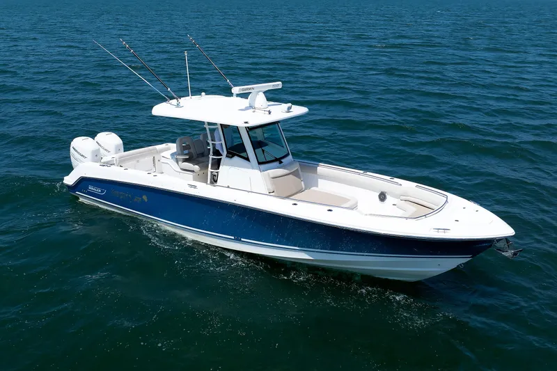 The Image of 2016 Boston Whaler 330 Outrage boat cruising on open water. - 0