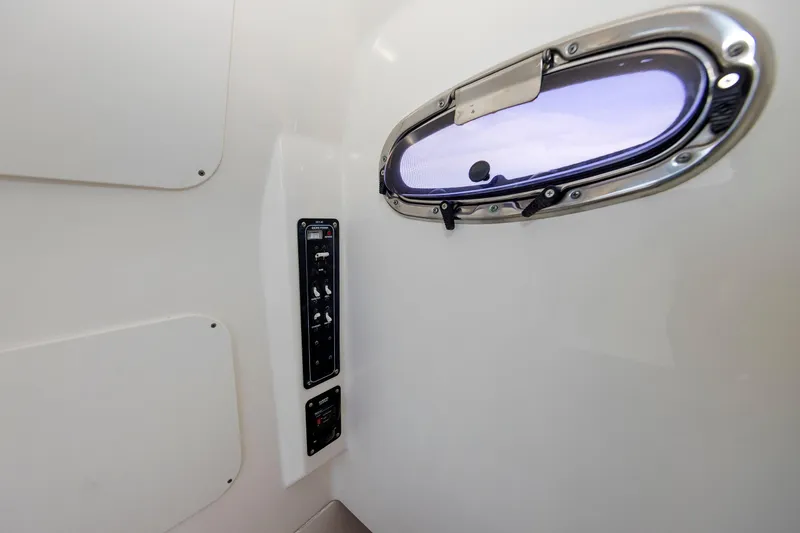 Slide: The Image of Interior view of 2016 Boston Whaler 330 Outrage with porthole and control panel. - 27