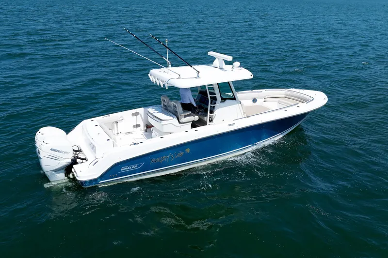 Slide: The Image of 2016 Boston Whaler 330 Outrage boat cruising on open water. - 28