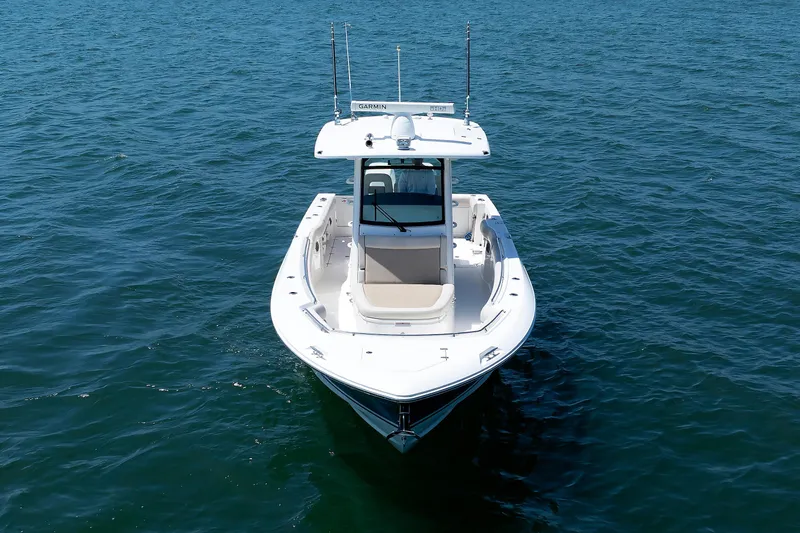 Slide: The Image of 2016 Boston Whaler 330 Outrage boat on open water, aerial view. - 29