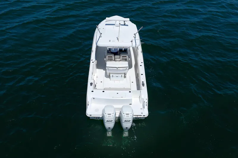 Slide: The Image of 2016 Boston Whaler 330 Outrage boat on open water, aerial view. - 30