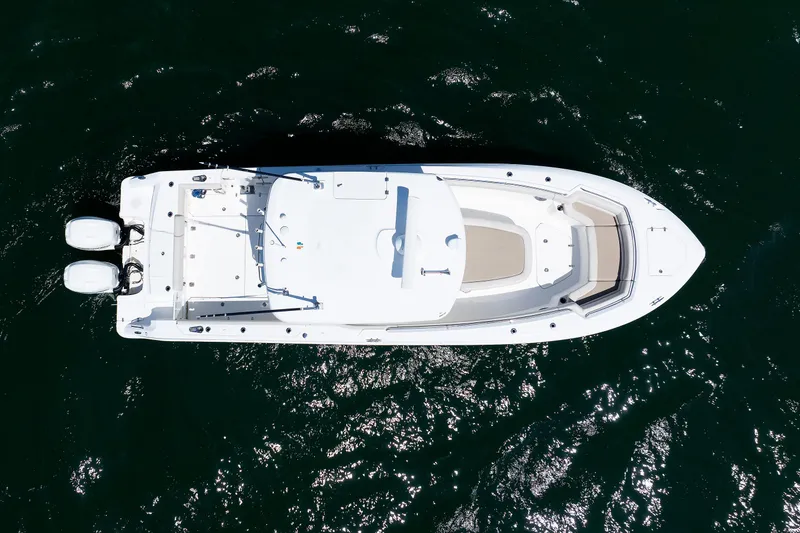 Slide: The Image of Aerial view of 2016 Boston Whaler 330 Outrage boat on dark water. - 31