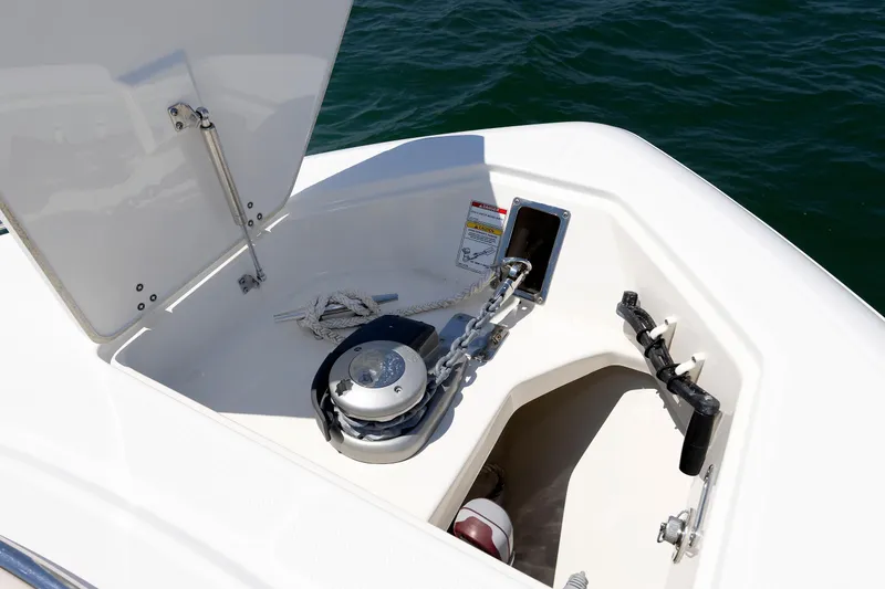 Slide: The Image of Anchor compartment of 2016 Boston Whaler 330 Outrage boat with chain and rope. - 7