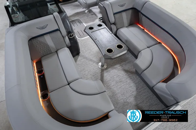 Slide: The Image of 2026 Bennington 22 MSB boat interior with luxurious seating and ambient lighting. - 11