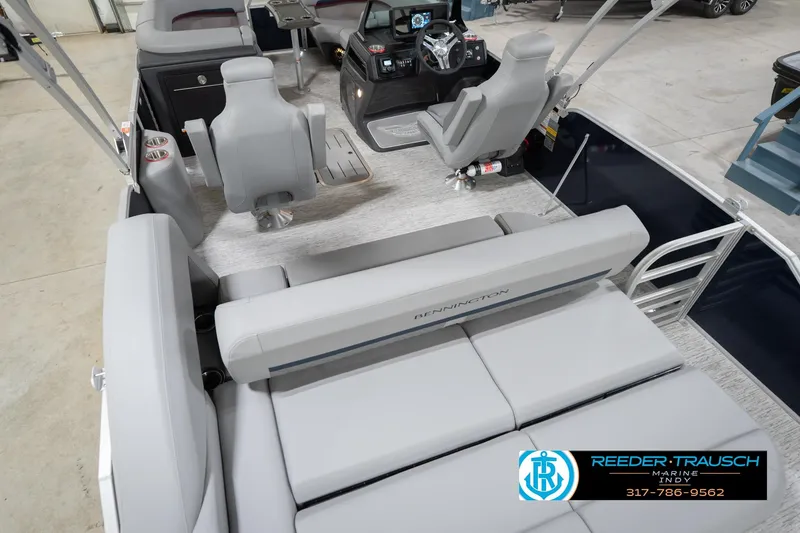 Slide: The Image of 2026 Bennington 22 MSB pontoon boat interior with seating and helm, showcased at Reeder-Trausch Marine. - 13