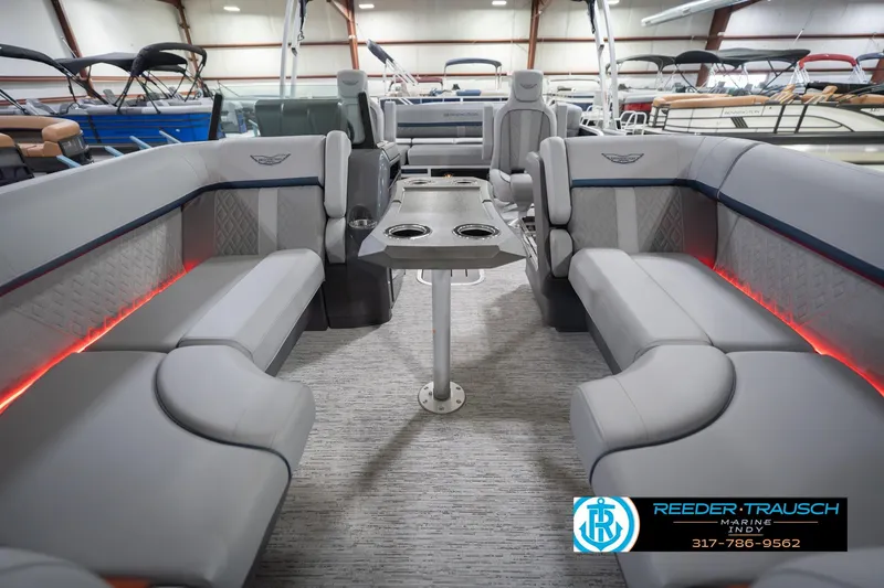 Slide: The Image of Luxurious interior of 2026 Bennington 22 MSB pontoon boat with plush seating and ambient lighting. - 14