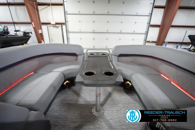 Slide: The Image of Luxurious interior of 2026 Bennington 22 MSB pontoon boat with sleek seating and modern table design. - 19