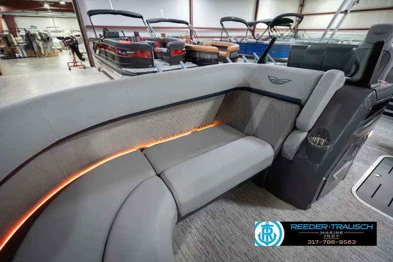 Slide: The Image of Luxurious interior of 2026 Bennington 22 MSB pontoon boat with elegant seating and ambient lighting. - 21
