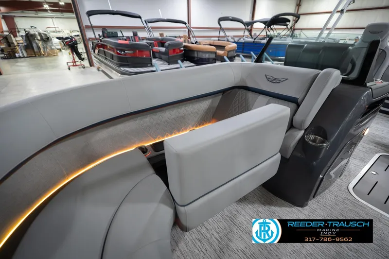 Slide: The Image of Interior of 2026 Bennington 22 MSB pontoon boat with luxurious seating and ambient lighting. - 23