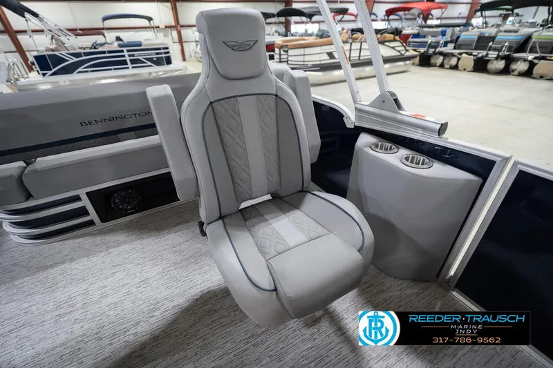 Slide: The Image of 2026 Bennington 22 MSB boat interior with luxury seating and cup holders. - 24