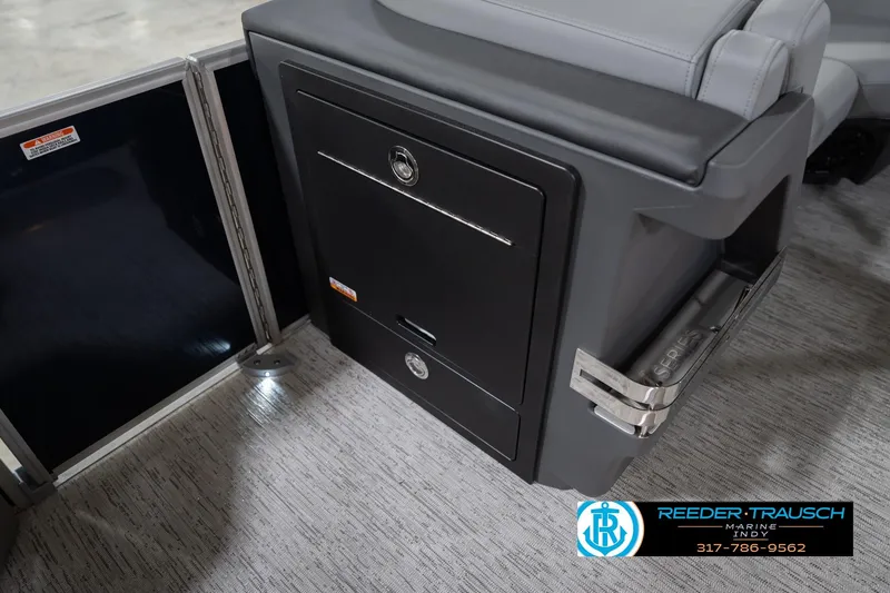 Slide: The Image of 2026 Bennington 22 MSB boat interior with storage compartment and seating. - 26