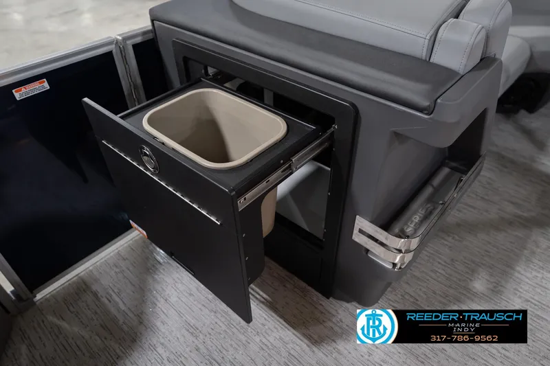 Slide: The Image of 2026 Bennington 22 MSB boat interior with pull-out storage compartment. - 27