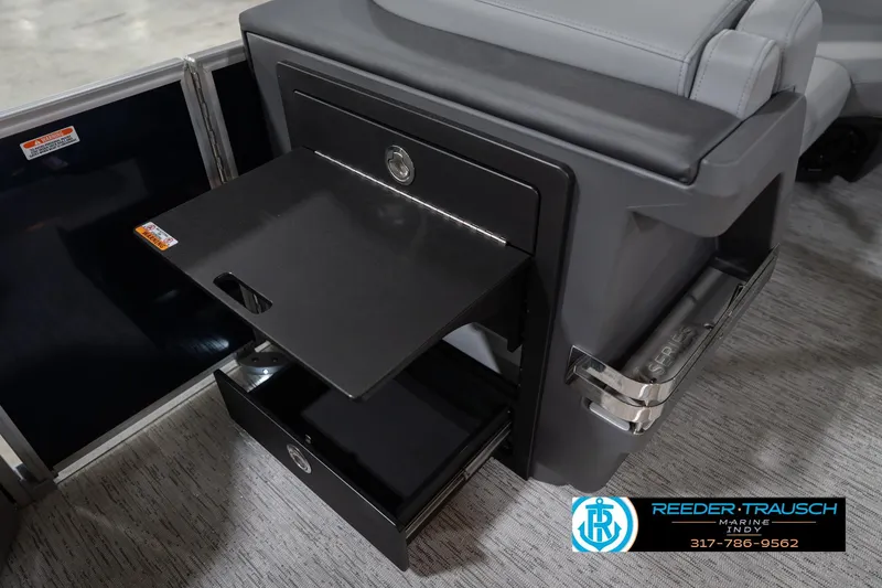 Slide: The Image of 2026 Bennington 22 MSB boat interior storage compartment with pull-out tray and drawer. - 28
