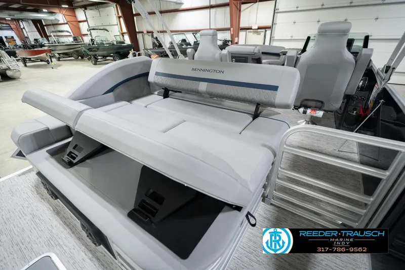 Slide: The Image of 2026 Bennington 22 MSB pontoon boat interior with luxurious seating in a showroom. - 33