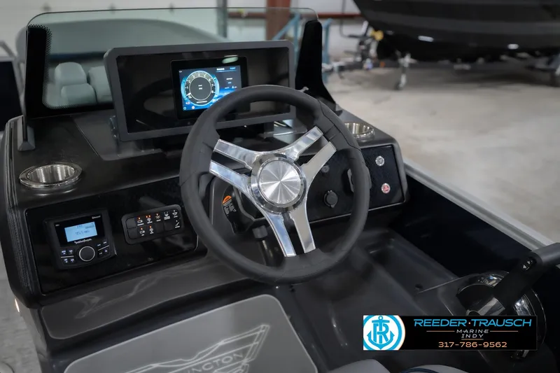 Slide: The Image of Steering console of 2026 Bennington 22 MSB boat with modern controls and display. - 35