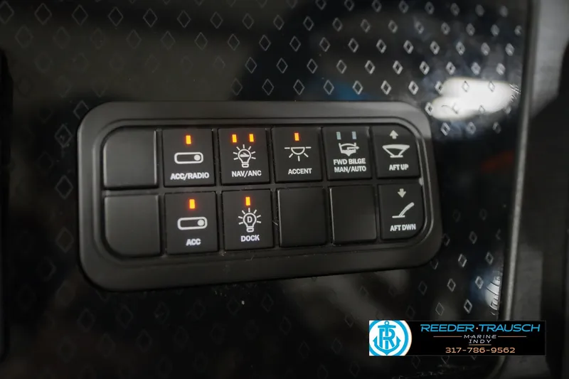 Slide: The Image of Control panel of a 2026 Bennington 22 MSB boat with various switches and indicators. - 38